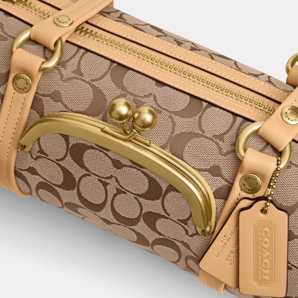 Borsa a botte Kisslock 28 in jacquard Signature