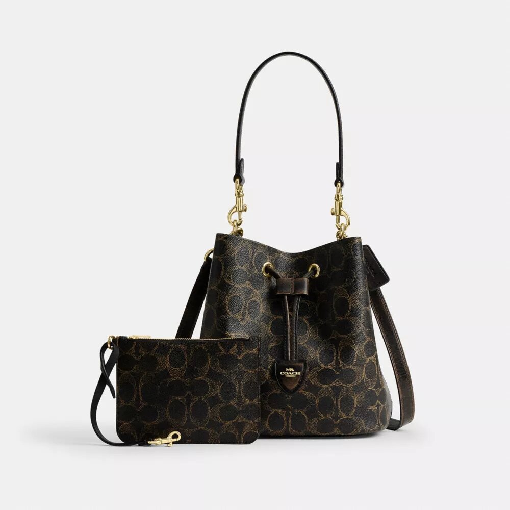 Borsa a secchiello Rowan in Signature Canvas con ciondoli