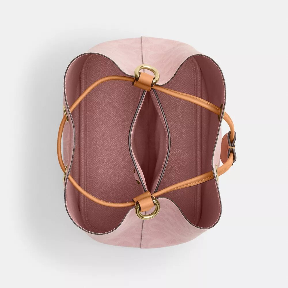 Borsa a secchiello Rowan in Signature Canvas con ciondoli