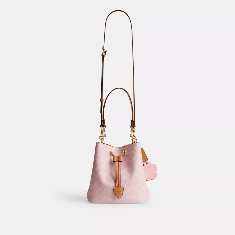 Borsa a secchiello Rowan in Signature Canvas con ciondoli