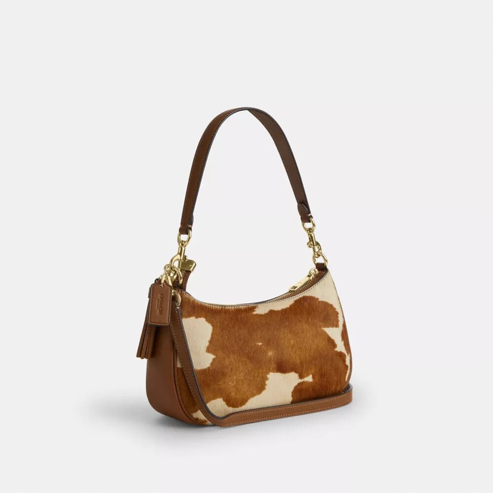 Borsa a spalla Teri in pelle di vitello con stampa bovina