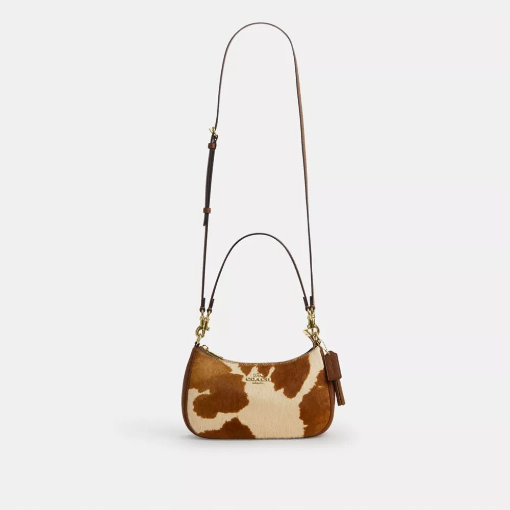 Borsa a spalla Teri in pelle di vitello con stampa bovina