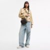 Borsa a tracolla Carey in Signature Canvas
