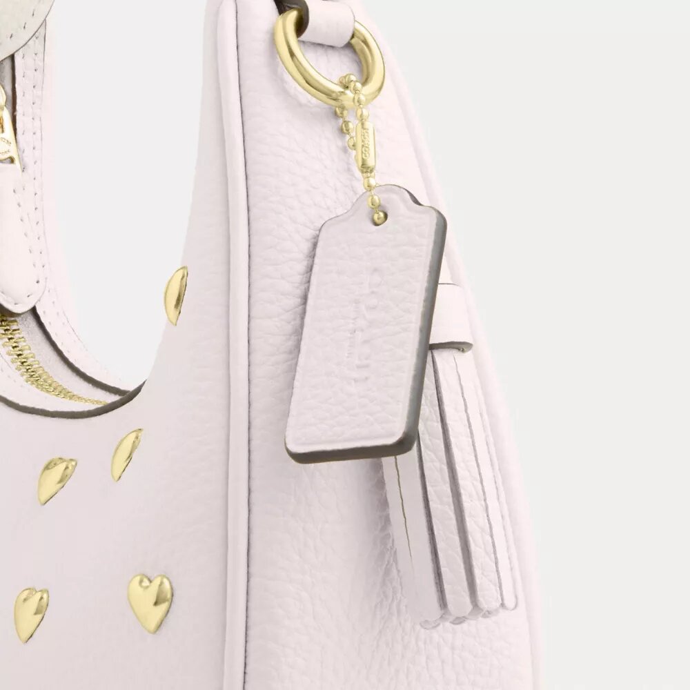 Borsa a tracolla Carmen Mini con rivetti a forma di cuore