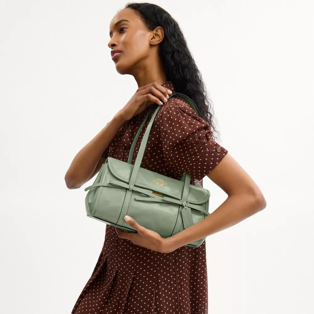 Borsa a tracolla con patta Bridget e fiocchi