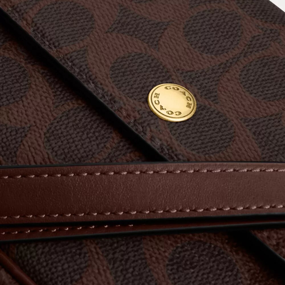 Borsa a tracolla con patta Brook in Signature Canvas