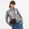 Borsa a tracolla con patta Brook in Signature Canvas