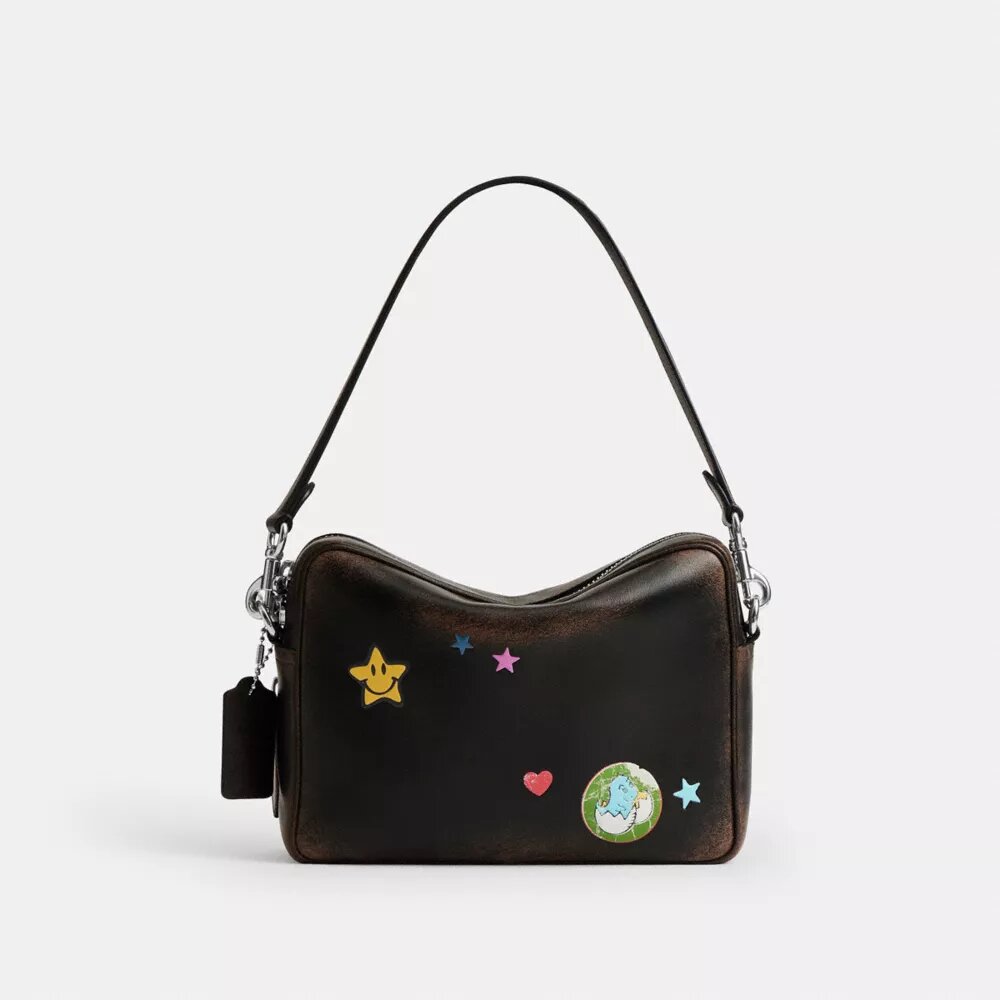 Borsa a tracolla Dakota per il decimo compleanno di Rexy in pelle "Loved" con stampa adesivi