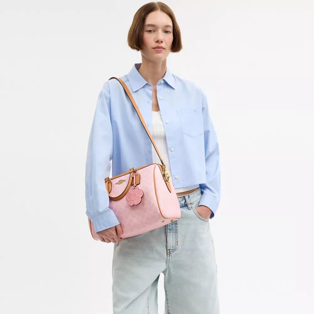 Borsa a tracolla grande Rowan in Signature Canvas con ciondoli