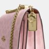 Borsa a tracolla Klare in Signature Canvas con ciondoli