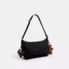 Borsa a tracolla Leo in Nylon esclusivo con ciondoli