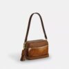 Borsa a tracolla Mini Carey in pelle di vitello con stampa bovina