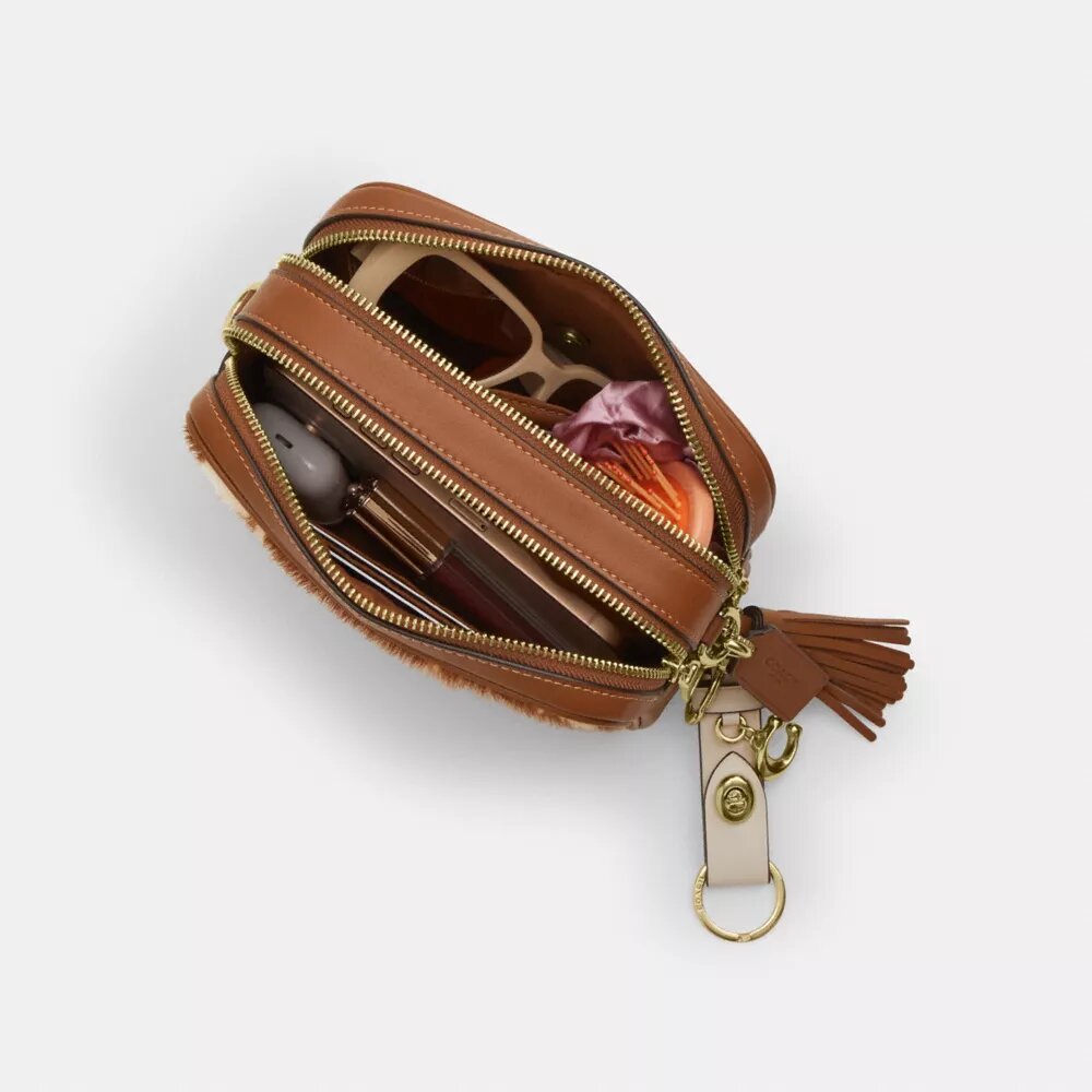 Borsa a tracolla Mini Carey in pelle di vitello con stampa bovina