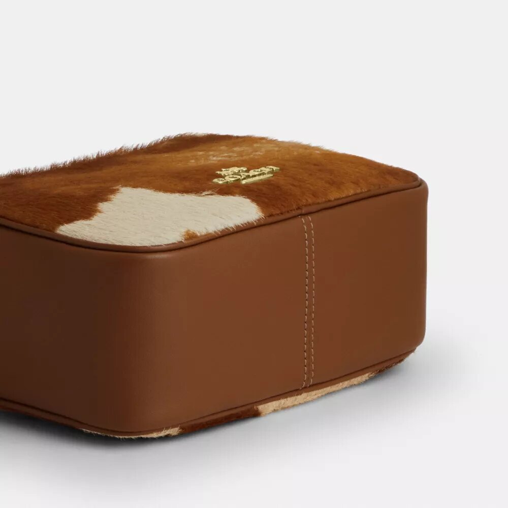 Borsa a tracolla Mini Carey in pelle di vitello con stampa bovina