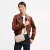 Borsa a tracolla Mini Carey in Signature Canvas
