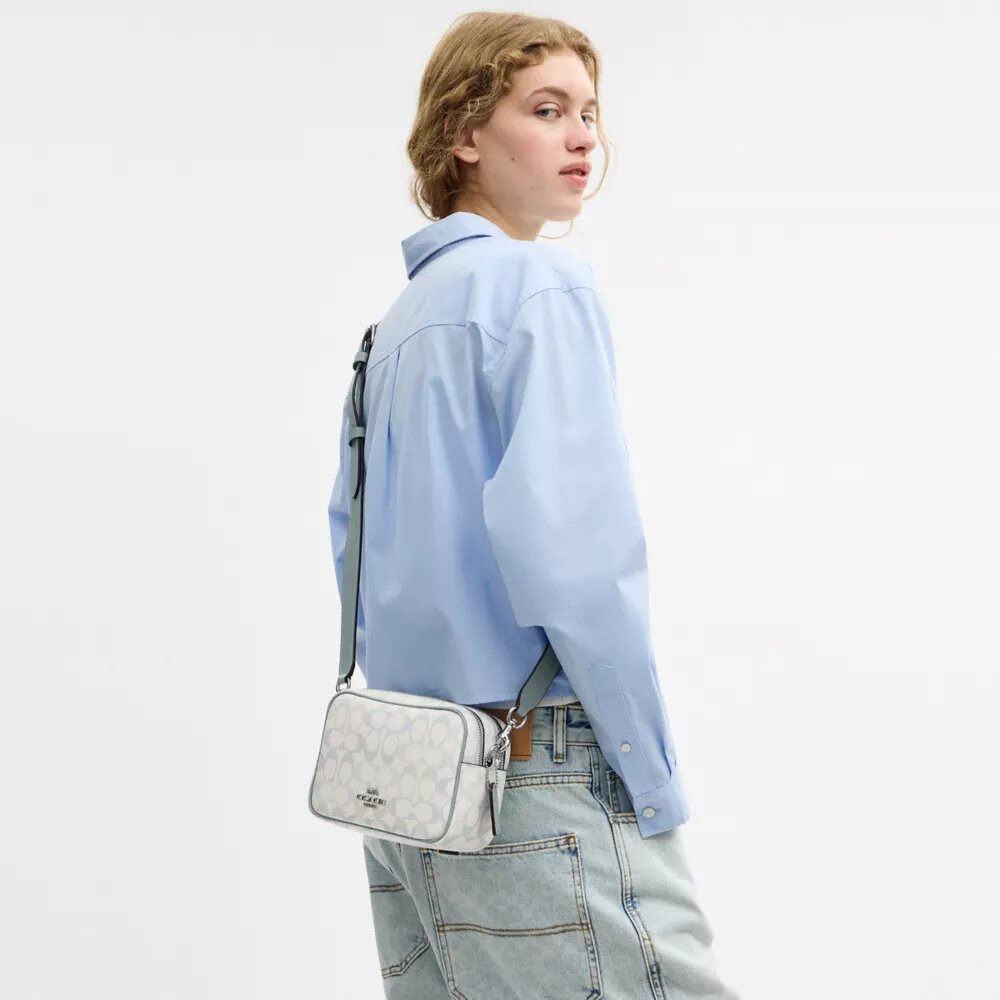 Borsa a tracolla Mini Carey in Signature Canvas