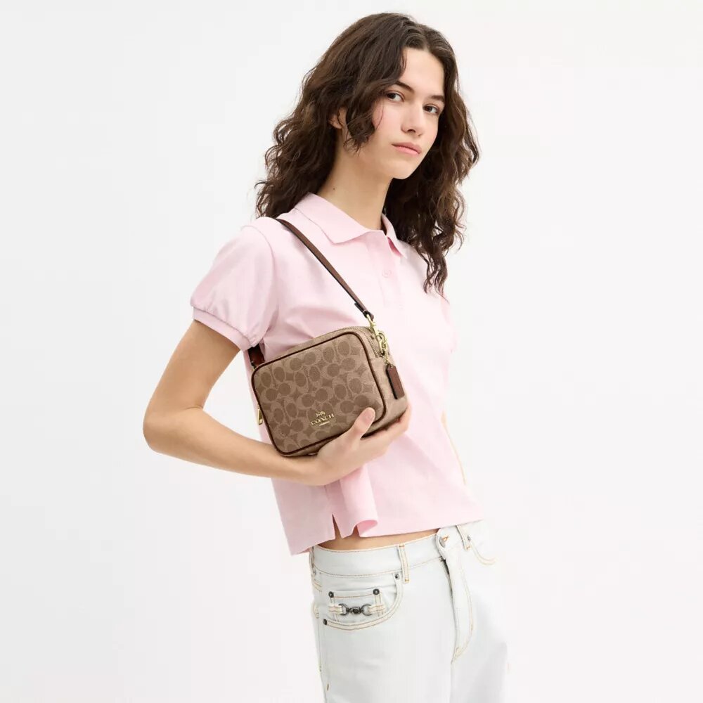Borsa a tracolla Mini Carey in Signature Canvas