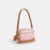 Borsa a tracolla Mini Carey in Signature Canvas con ciondoli
