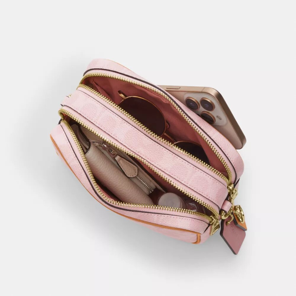 Borsa a tracolla Mini Carey in Signature Canvas con ciondoli