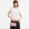 Borsa a tracolla Mini Rowan in Signature Canvas con ciondoli