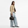 Borsa a tracolla Rowan in Signature Canvas con ciondoli