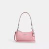 Borsa a tracolla Teri Mini in pelle firmata con ciondolo a forma di cuore