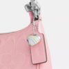 Borsa a tracolla Teri Mini in pelle firmata con ciondolo a forma di cuore