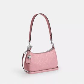 Borsa a tracolla Teri Mini in pelle firmata con ciondolo a forma di cuore