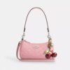 Borsa a tracolla Teri Mini in pelle firmata con ciondolo a forma di cuore