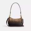 Borsa a tracolla Teri Mini in Signature Canvas