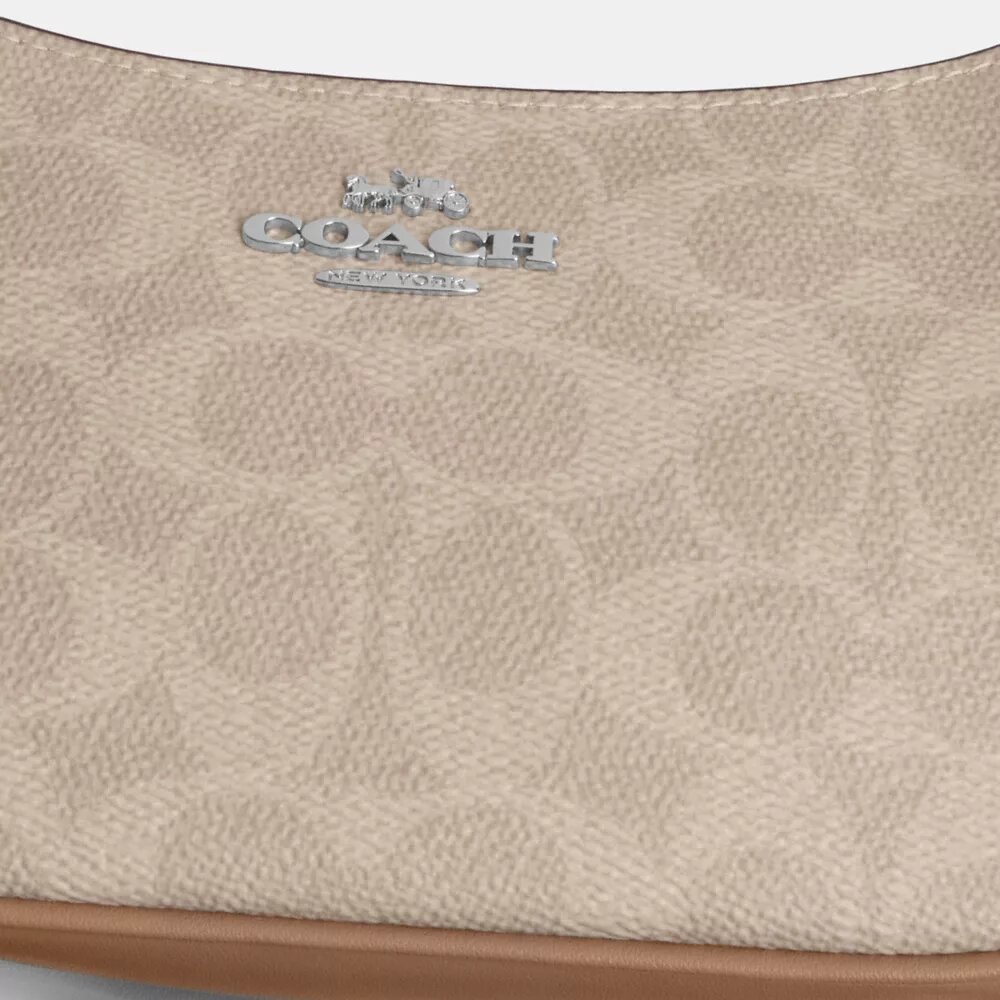 Borsa a tracolla Teri Mini in Signature Canvas