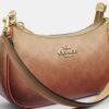 Borsa a tracolla Teri Mini in Signature Canvas