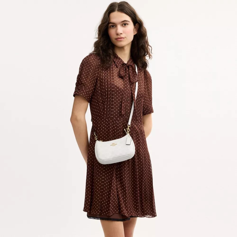Borsa a tracolla Teri Mini in Signature Canvas
