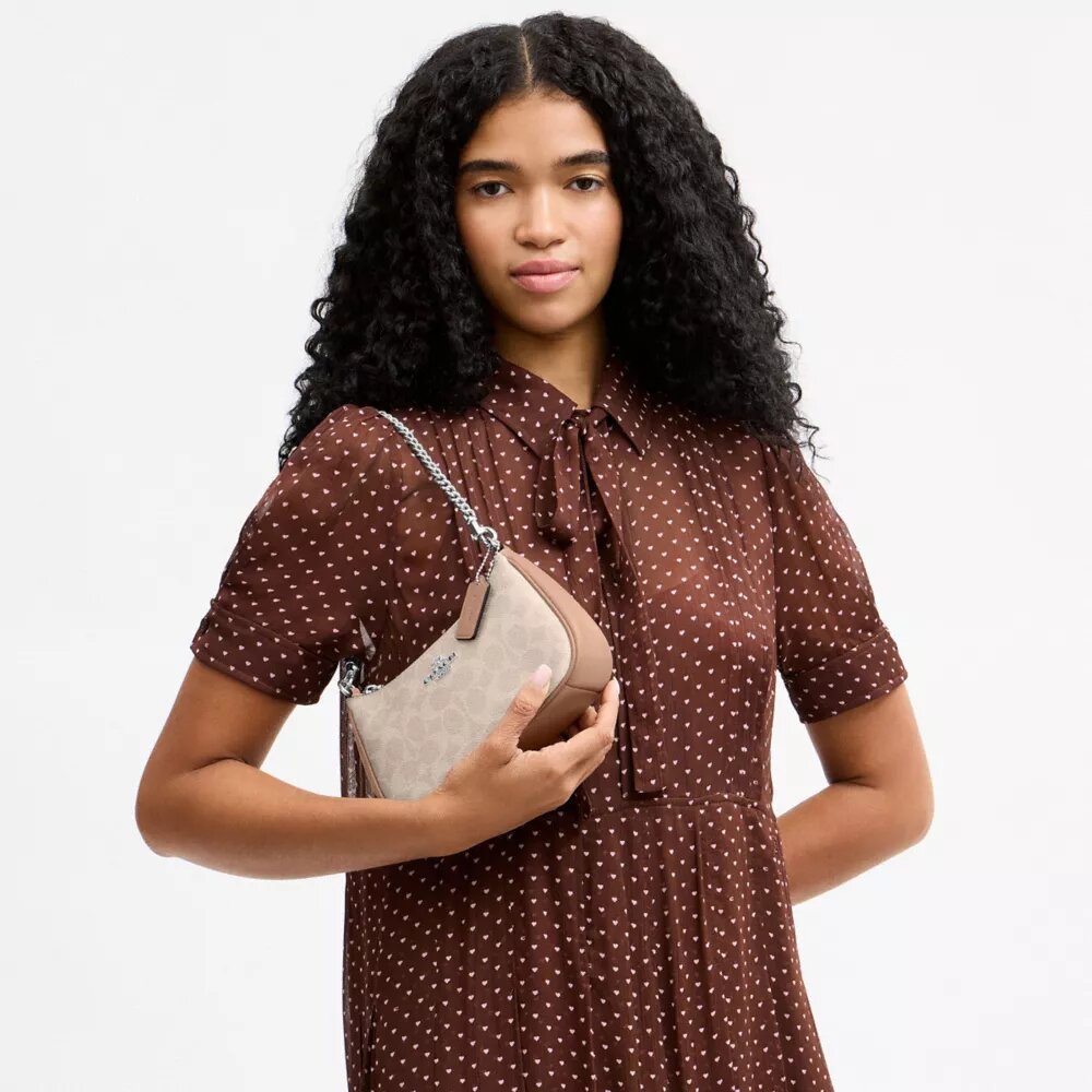 Borsa a tracolla Teri Mini in Signature Canvas