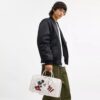 Borsa Compass 35 Disney X Coach con Topolino