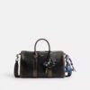 Borsa Compass 35 in pelle invecchiata con ciondoli