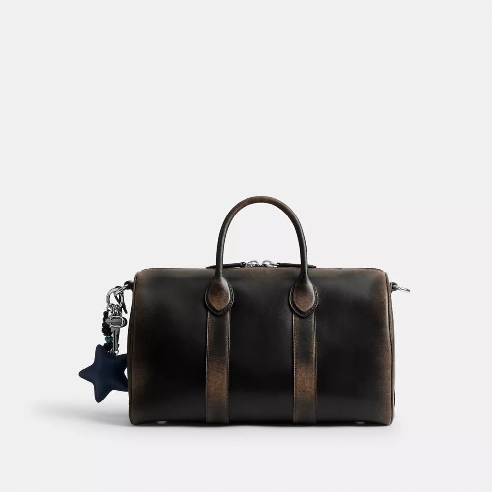 Borsa Compass 35 in pelle invecchiata con ciondoli
