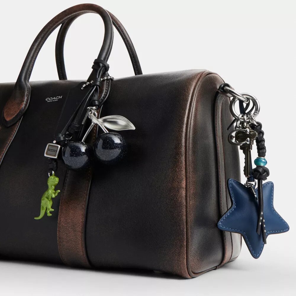 Borsa Compass 35 in pelle invecchiata con ciondoli