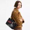 Borsa Disney X Coach Rogue 25 con Pluto