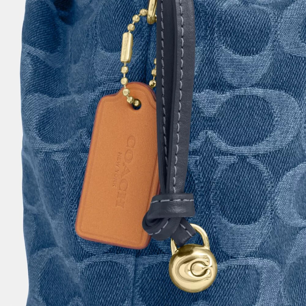 Borsa Faye Mini con coulisse in denim Signature