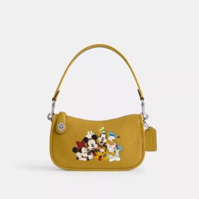 Borsa Swinger Disney X Coach in pelle rigenerativa con Topolino e i suoi amici