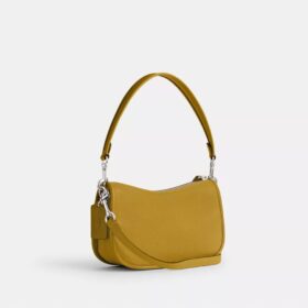 Borsa Swinger Disney X Coach in pelle rigenerativa con Topolino e i suoi amici