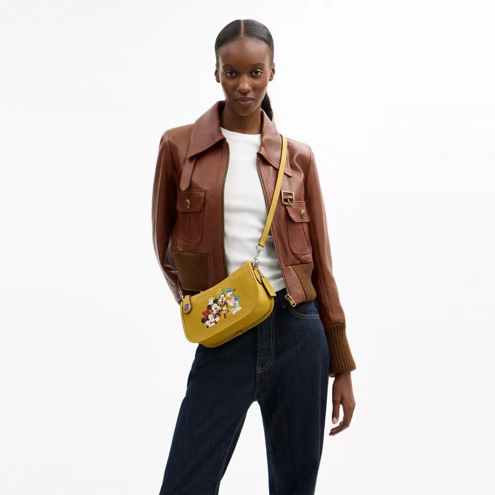 Borsa Swinger Disney X Coach in pelle rigenerativa con Topolino e i suoi amici