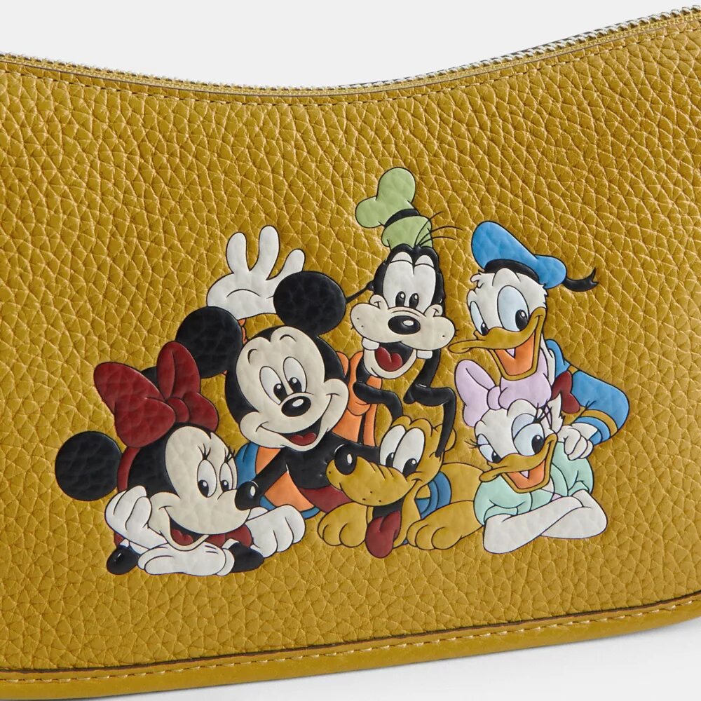 Borsa Swinger Disney X Coach in pelle rigenerativa con Topolino e i suoi amici