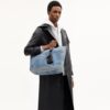 Borsa Tote "Small Tour" in denim "Loved" con ciondoli