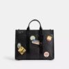 Borsa Wesley in Signature Canvas con toppe