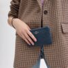 Borsello da polso con cerniera angolare in jacquard Signature