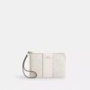 Borsello da polso con cerniera angolare in Signature Canvas a righe