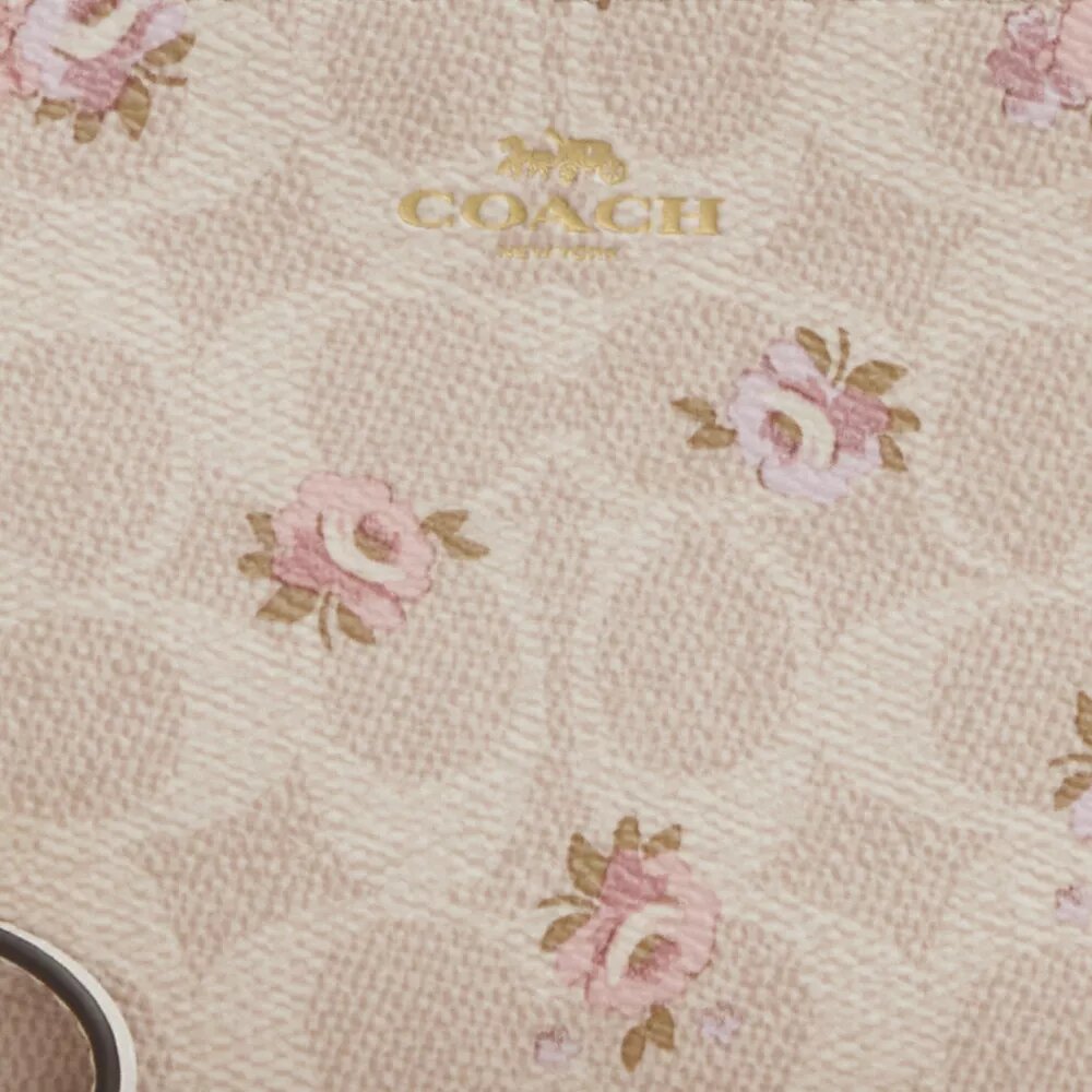 Borsello da polso con cerniera angolare in Signature Canvas con stampa floreale