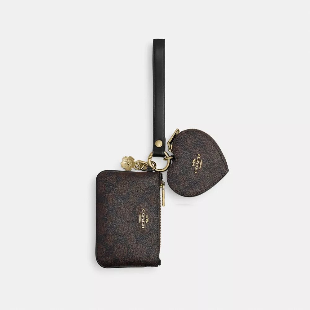 Borsello da polso e pochette a forma di cuore in Signature Canvas con ciondolo